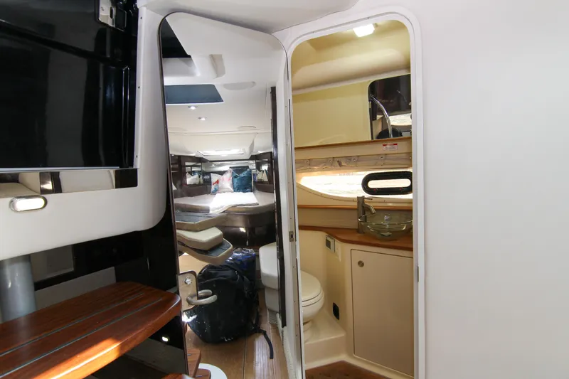 Slide: The Image of Interior of 2017 Sea Ray 350 Coupe, featuring cabin and bathroom area. - 9