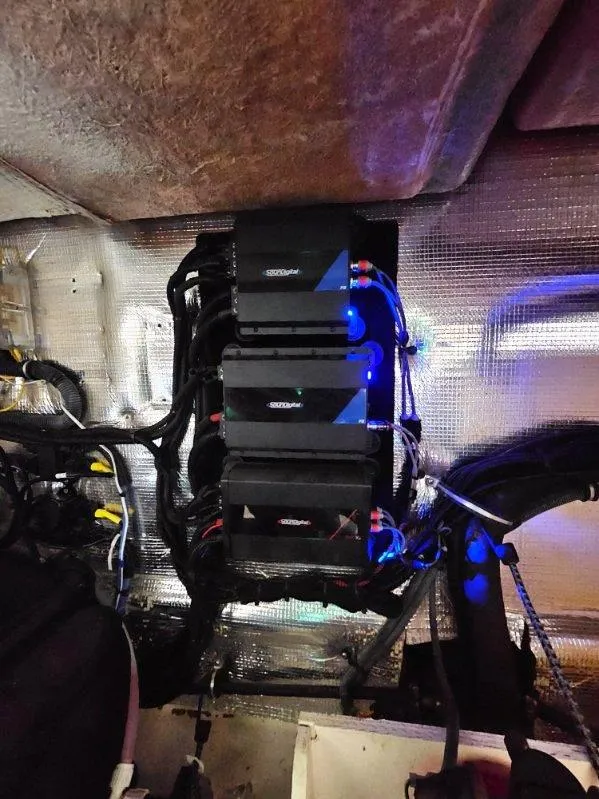 Slide: The Image of Engine compartment of a 2005 Chaparral Signature 330 boat with visible wiring and components. - 14