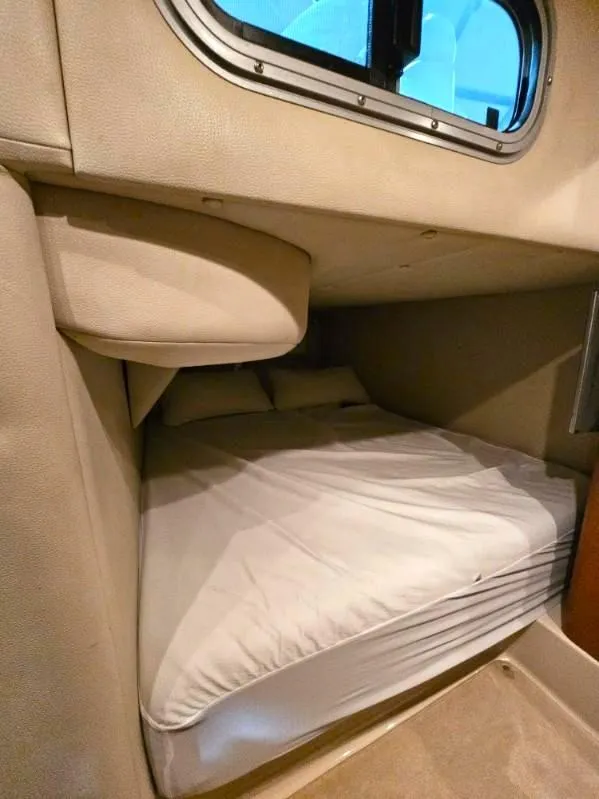 Slide: The Image of 2005 Chaparral Signature 330 cabin interior with cozy sleeping area. - 16