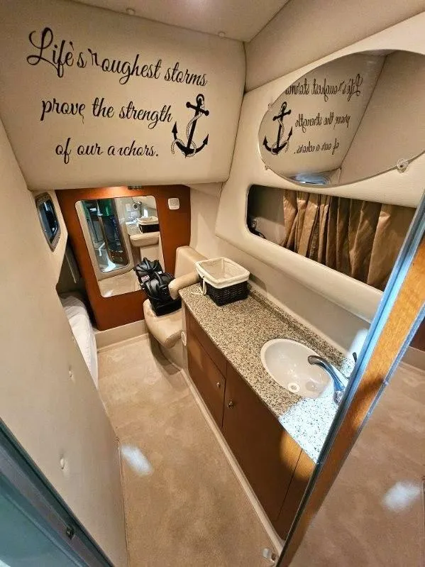 Slide: The Image of 2005 Chaparral Signature 330 interior with nautical decor and motivational quote. - 17