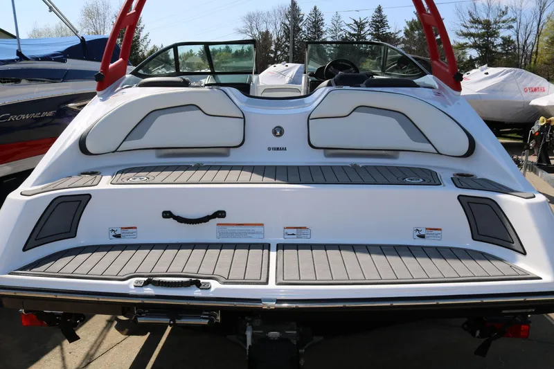 Slide: The Image of 2018 Yamaha Boats AR 195 rear view, showcasing swim platform and seating. - 5