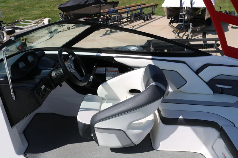 Slide: The Image of 2018 Yamaha Boats AR 195 interior with steering wheel and seating. - 9