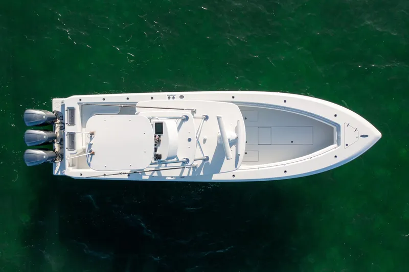Slide: The Image of 2018 Contender 39 ST boat, aerial view, on clear green water. - 12