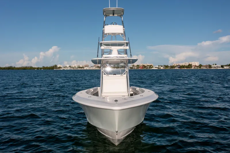 Slide: The Image of 2018 Contender 39 ST boat on open water, clear sky background. - 6