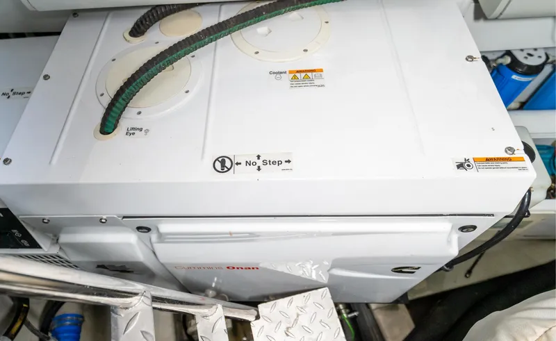 Slide: The Image of Engine room of 2016 Sunseeker Manhattan 55 yacht, featuring a Cummins Onan generator. - 102
