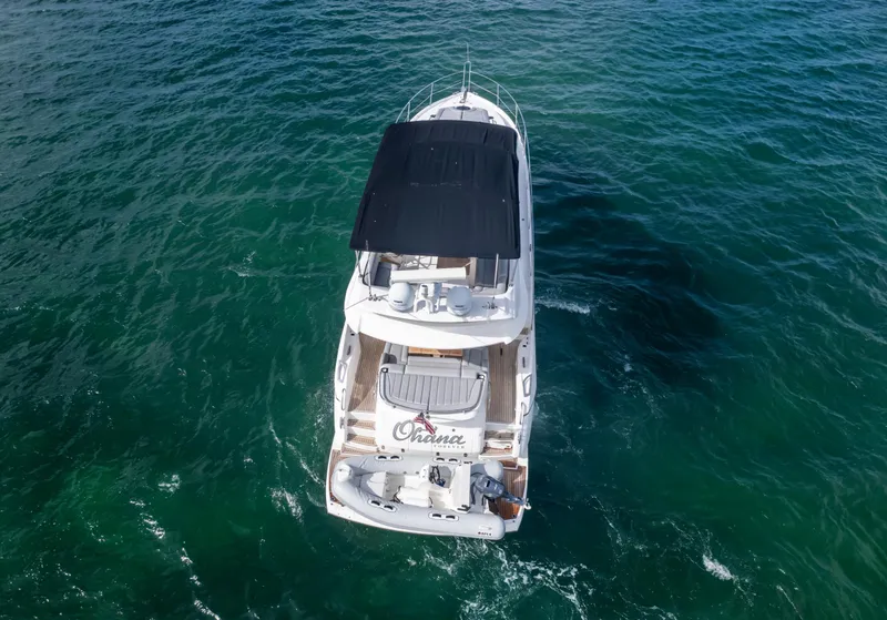 Slide: The Image of Sunseeker Manhattan 55 yacht cruising on open water, aerial view, 2016 model. - 14