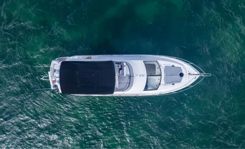 Slide: The Image of Overhead view of 2016 Sunseeker Manhattan 55 yacht on clear blue water. - 19