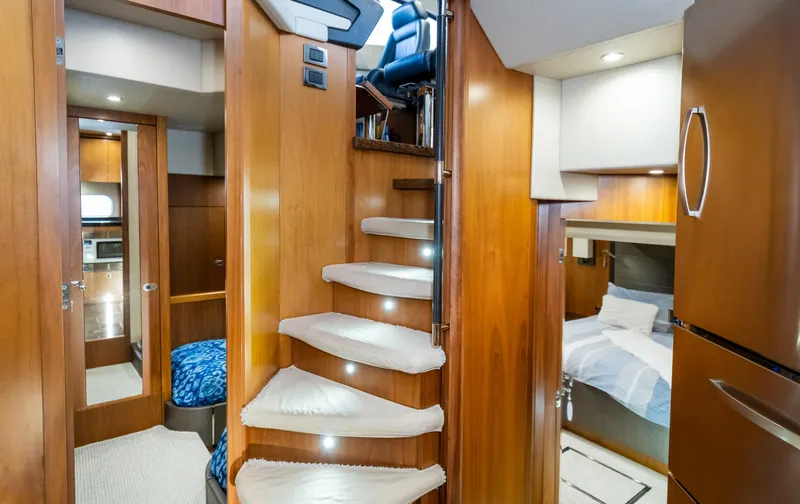 Slide: The Image of Luxurious interior of 2016 Sunseeker Manhattan 55 yacht with wooden stairs and cozy cabins. - 23