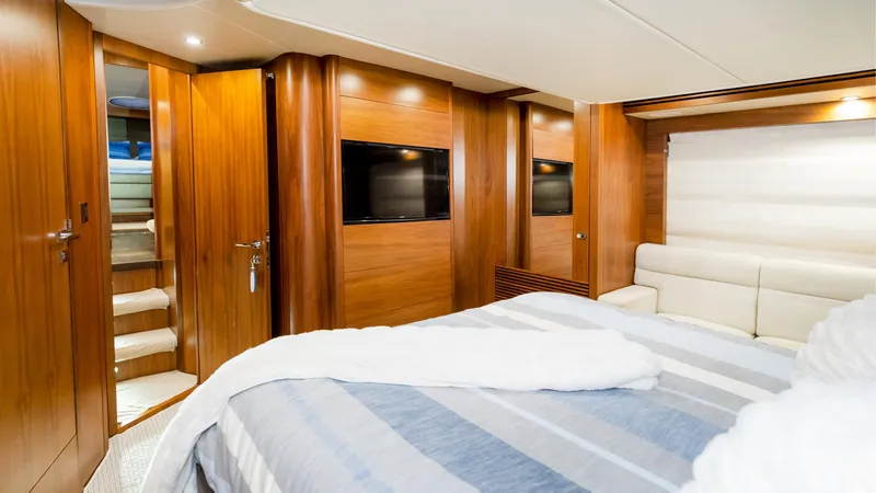 Slide: The Image of Luxurious cabin interior of 2016 Sunseeker Manhattan 55 yacht with wood paneling and modern amenities. - 26