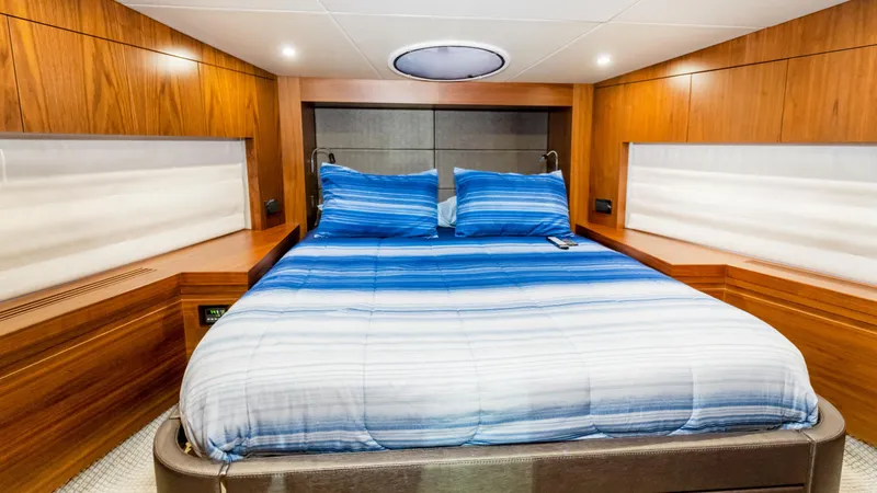 Slide: The Image of Luxurious cabin interior of 2016 Sunseeker Manhattan 55 yacht with blue bedding. - 29
