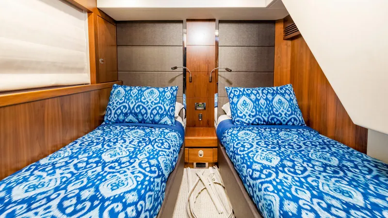 Slide: The Image of Twin cabin with blue bedding in 2016 Sunseeker Manhattan 55 yacht. - 33