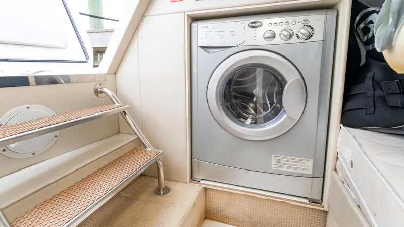 Slide: The Image of Laundry area on 2016 Sunseeker Manhattan 55 yacht with washing machine and stairs. - 36