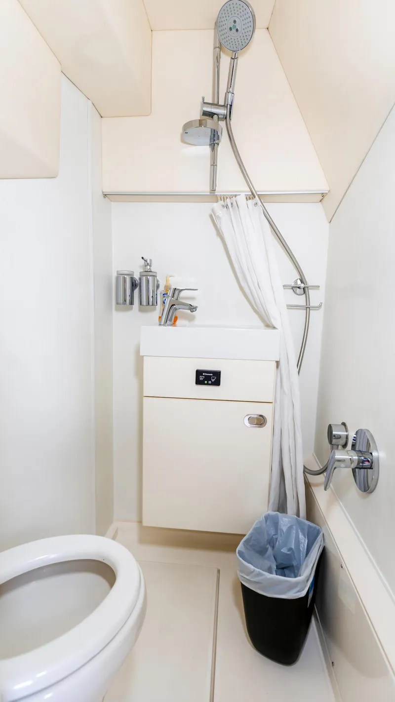 Slide: The Image of Compact bathroom in 2016 Sunseeker Manhattan 55 yacht with shower and toilet. - 37