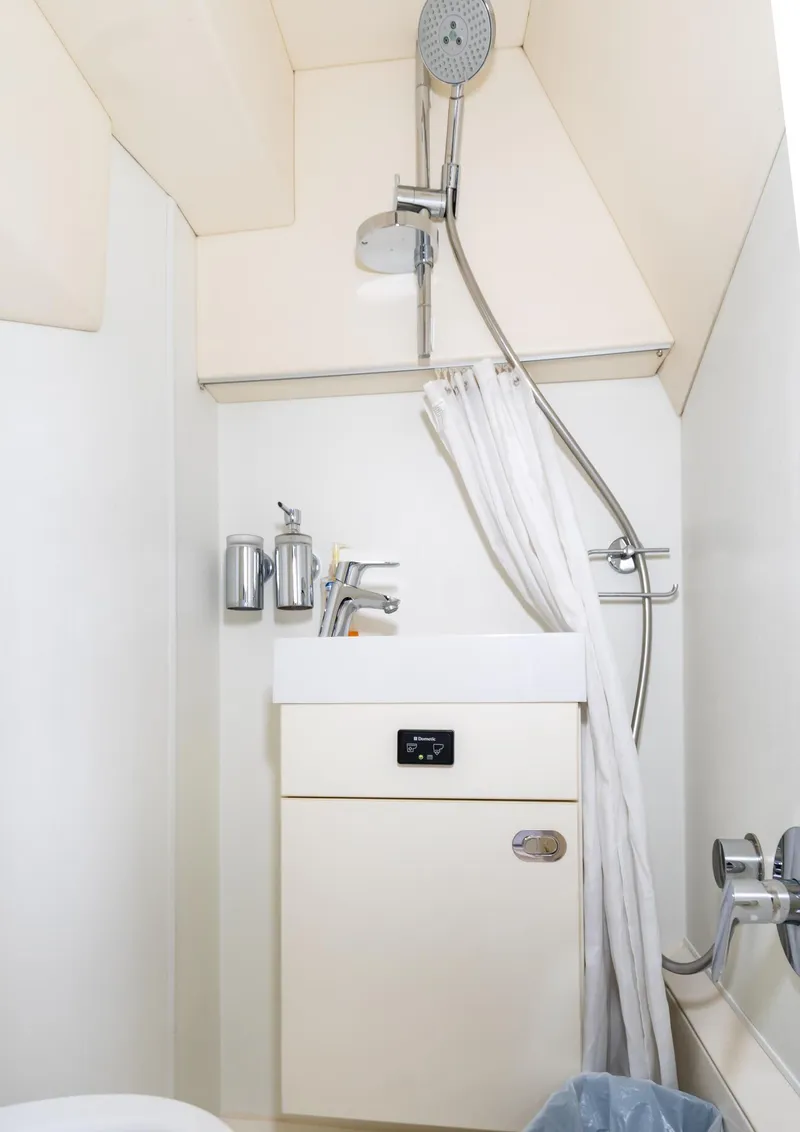 Slide: The Image of Compact bathroom in a 2016 Sunseeker Manhattan 55 yacht with shower and sink. - 39