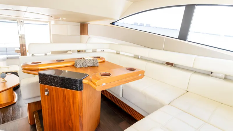 Slide: The Image of Luxurious interior of 2016 Sunseeker Manhattan 55 yacht with elegant seating and wooden table. - 41