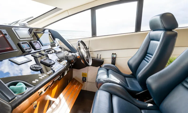 Slide: The Image of Interior cockpit of 2016 Sunseeker Manhattan 55 yacht with leather seats and control panel. - 47