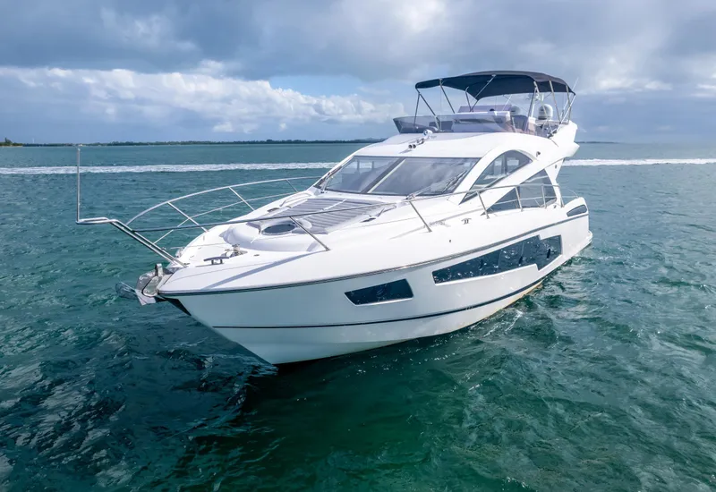 Slide: The Image of Luxury Sunseeker Manhattan 55 yacht cruising on open water, 2016 model. - 7