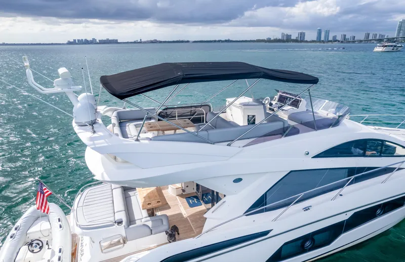 Slide: The Image of Luxurious 2016 Sunseeker Manhattan 55 yacht cruising on serene waters. - 8