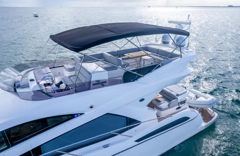 Slide: The Image of Luxurious 2016 Sunseeker Manhattan 55 yacht cruising on open water. - 9