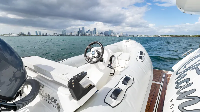 Slide: The Image of Sunseeker Manhattan 55 yacht, 2016 model, with city skyline in the background. - 90