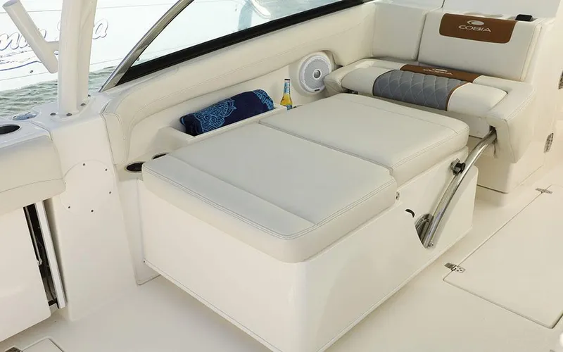 Slide: The Image of 2025 Cobia 280 DC boat interior with comfortable seating and storage. - 14