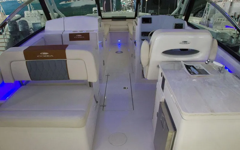 Slide: The Image of Luxurious interior of 2025 Cobia 280 DC boat with modern seating and amenities. - 15