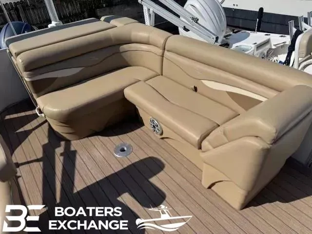 Slide: The Image of 2017 Bennington 21SLX boat with beige seating on a wooden deck. - 4