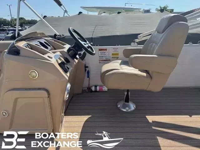 Slide: The Image of 2017 Bennington 21SLX boat interior with captain's chair and steering console. - 5