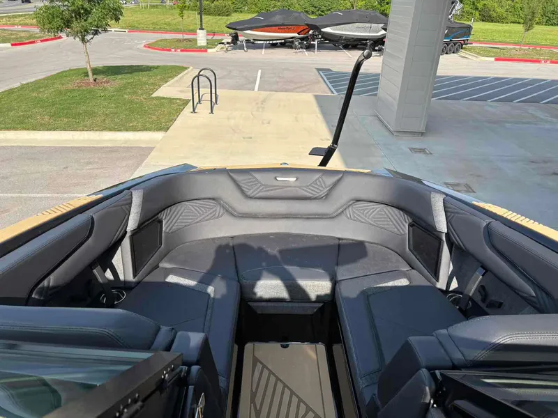 Slide: The Image of 2025 MasterCraft XSTAR23 boat interior with sleek seating and modern design. - 11