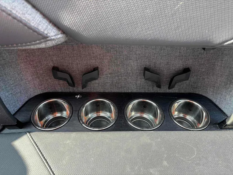 Slide: The Image of 2025 MasterCraft XSTAR23 interior with four stainless steel cup holders. - 15