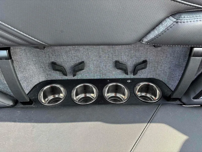 Slide: The Image of 2025 MasterCraft XSTAR23 interior cup holders and seat detail. - 16