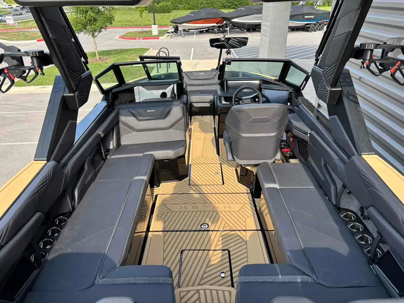 Slide: The Image of 2025 MasterCraft XSTAR23 boat interior with sleek seating and modern design. - 8