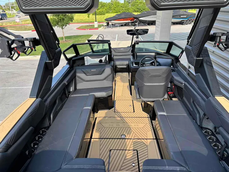 Slide: The Image of 2025 MasterCraft XSTAR23 boat interior with sleek seating and modern design. - 9