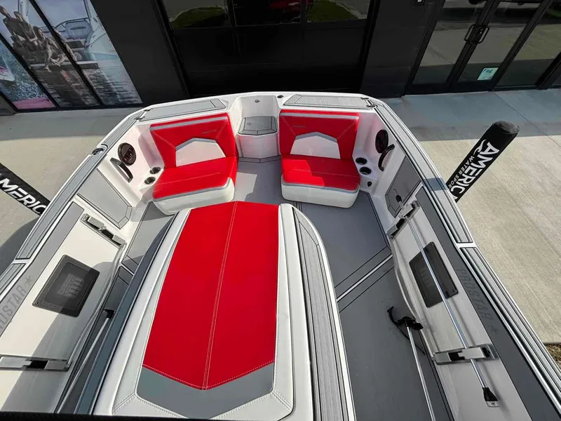 Slide: The Image of 2025 MasterCraft ProStar boat interior with red and white seating, modern design. - 3