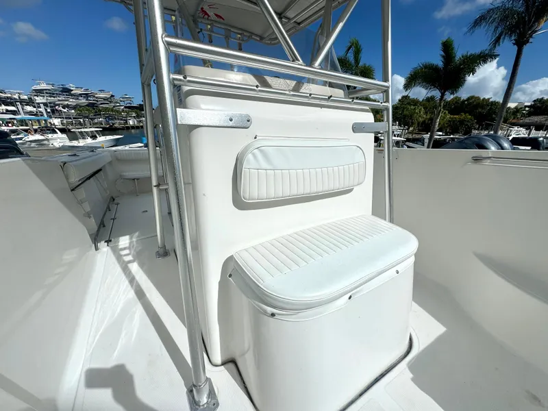Slide: The Image of 2005 Sea Fox 287 Center Console boat interior with seating and stainless steel frame. - 11