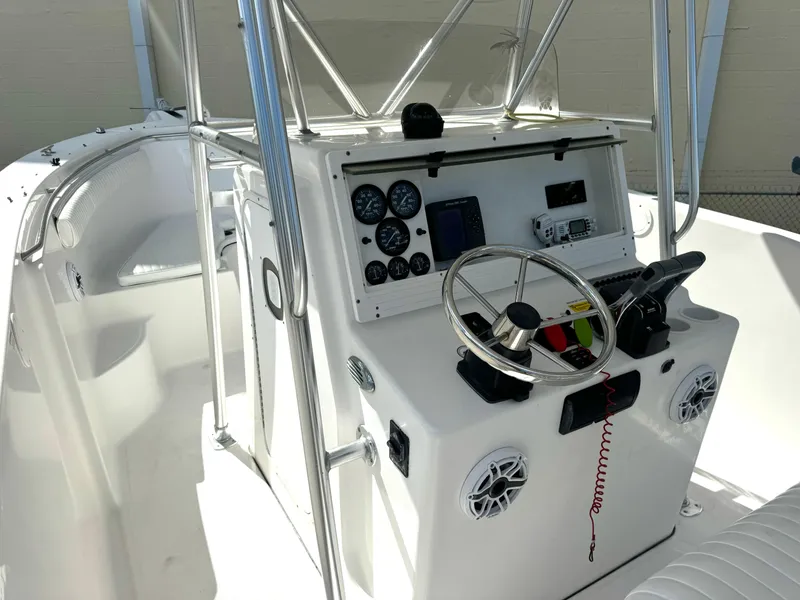 Slide: The Image of 2005 Sea Fox 287 Center Console boat dashboard with steering wheel and navigation instruments. - 7