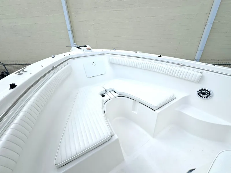Slide: The Image of 2005 Sea Fox 287 Center Console boat interior with white seating and speaker. - 8