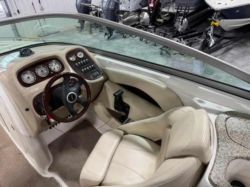 Slide: The Image of 2005 Chaparral 256 SSi boat interior with steering wheel and control panel. - 13