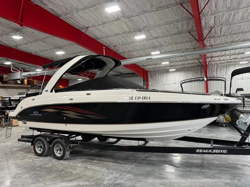 Slide: The Image of 2005 Chaparral 256 SSi boat on trailer in indoor storage facility. - 15