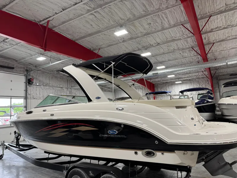 Slide: The Image of 2005 Chaparral 256 SSi boat in indoor showroom, side view with trailer. - 4