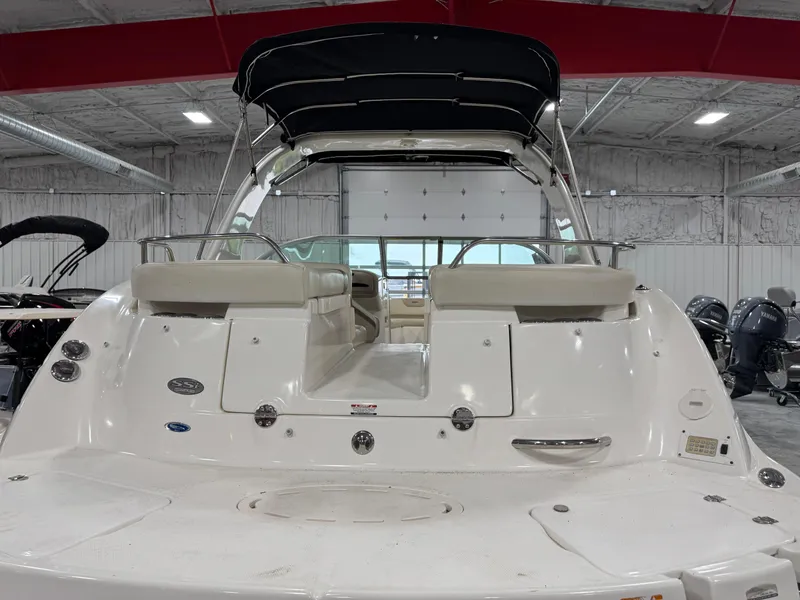 Slide: The Image of 2005 Chaparral 256 SSi boat with canopy in indoor showroom. - 5