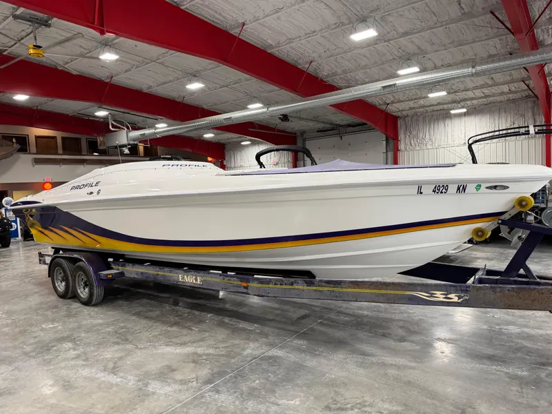 Slide: The Image of 2003 Profile 290 boat on trailer in indoor storage facility. - 5