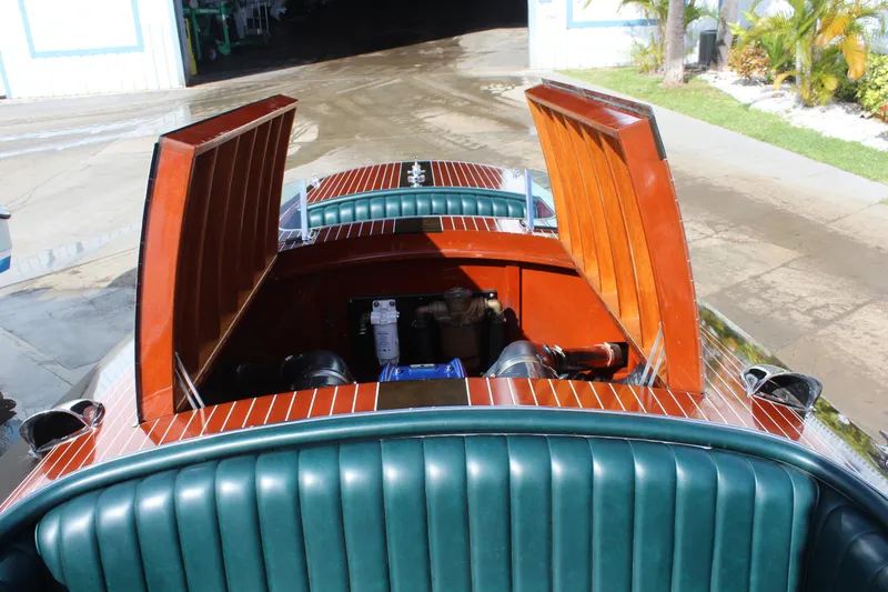 Slide: The Image of Open engine compartment of 2017 Hacker-Craft 30 boat with wooden detailing. - 10