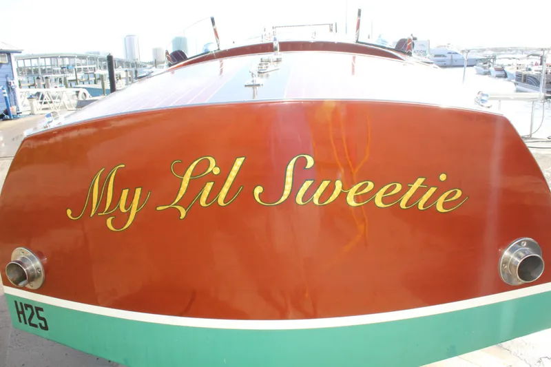 Slide: The Image of 2017 Hacker-Craft 30 boat named "My Lil Sweetie" at a marina. - 14