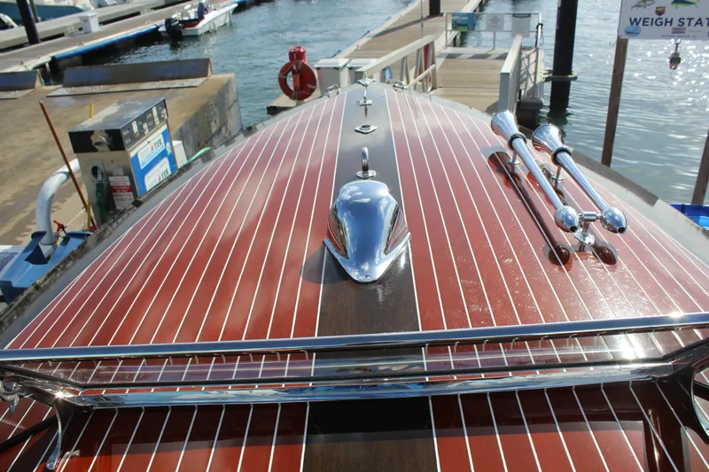 Slide: The Image of 2017 Hacker-Craft 30 boat with polished wood deck at marina dock. - 9