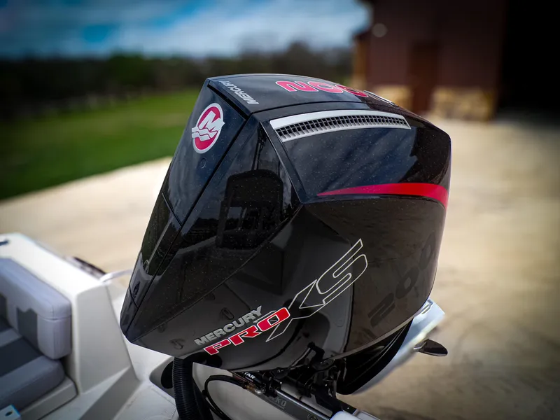 Slide: The Image of Outboard motor on 2025 Mako 214CC boat, featuring Mercury Pro XS branding. - 12