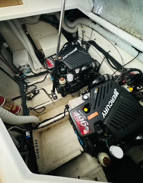 Slide: The Image of Engine room of 2006 Rinker 390 Express Cruiser with twin Mercury engines. - 19