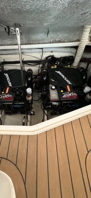 Slide: The Image of 2006 Rinker 390 Express Cruiser engine compartment with twin MerCruiser 496 engines. - 21