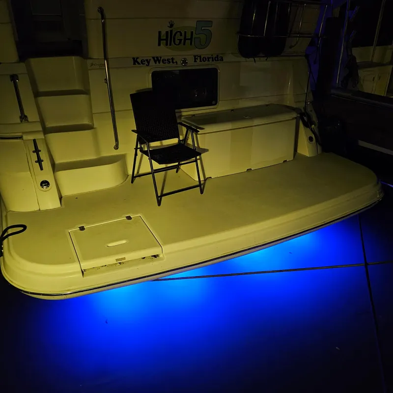 Slide: The Image of 1999 Cruisers Yachts 3750 Motoryacht with blue underwater lights in Key West, Florida. - 15