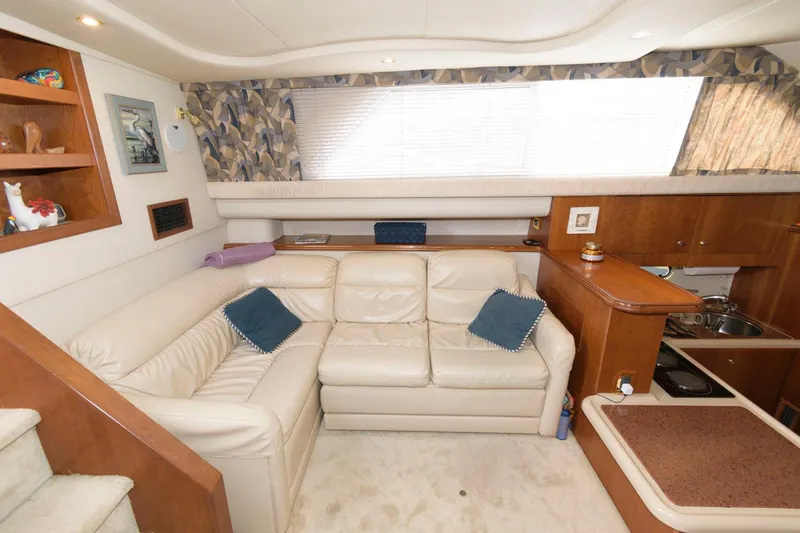 Slide: The Image of Luxurious interior of 1999 Cruisers Yachts 3750 Motoryacht with plush seating and elegant decor. - 18